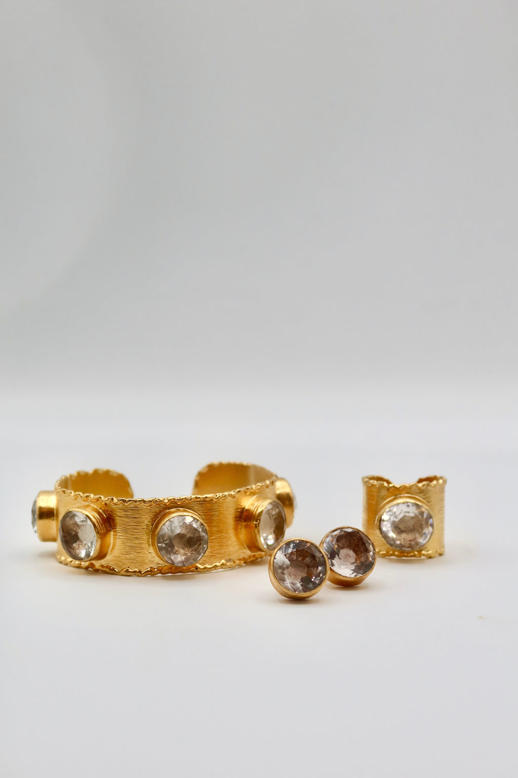 The Aurora Gem Set in Gold with Silver Crystal